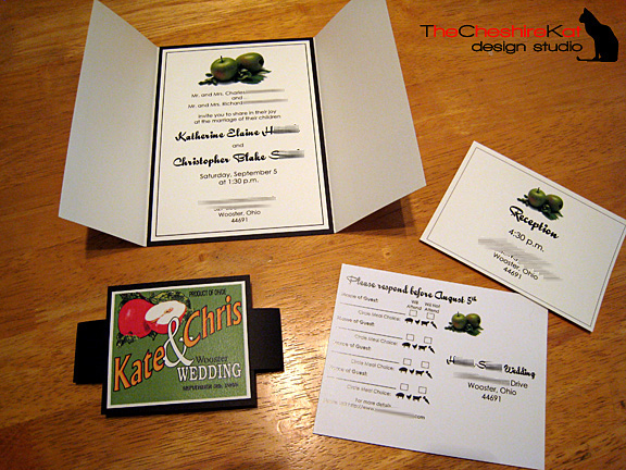 The full suite, with the open gatefold, belly band, RSVP postcard, and reception card.  
